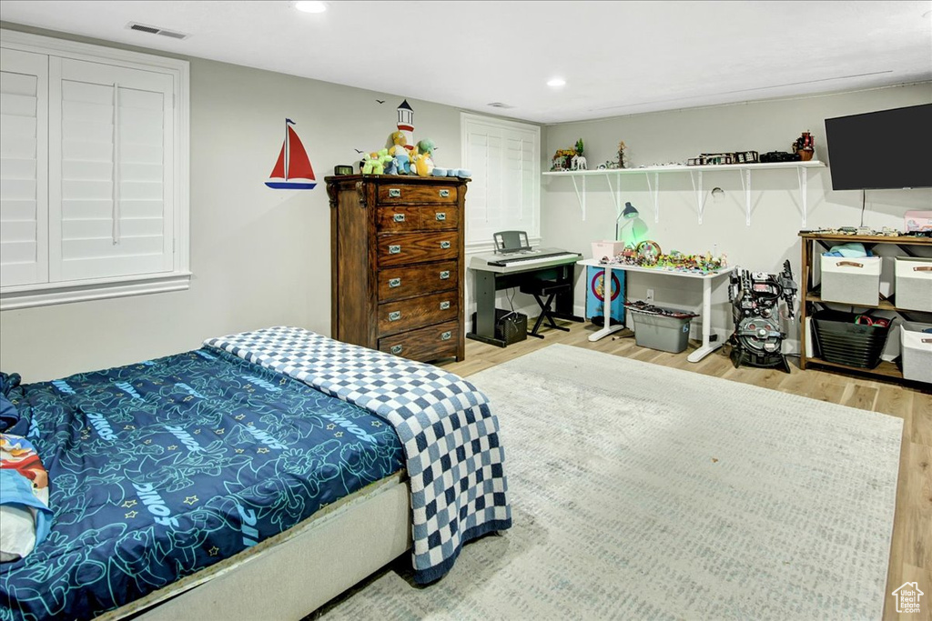 Bedroom featuring light wood finished floors and recessed lighting