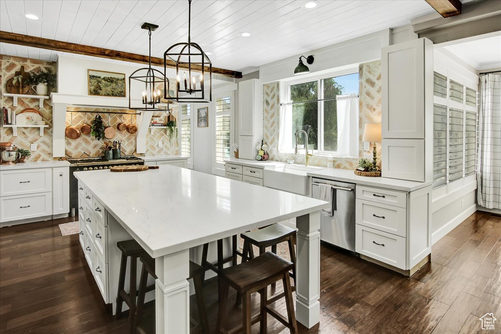 Kitchen with dishwasher, wooden ceiling, recessed lighting, a breakfast bar, and dark wood-style flooring