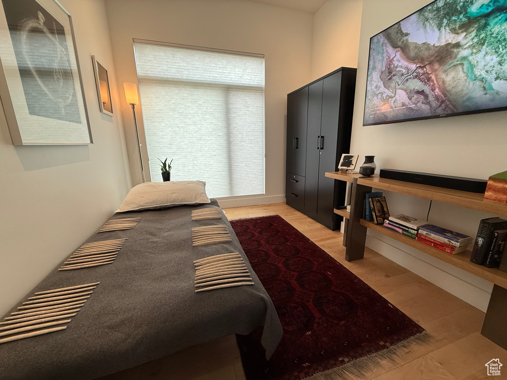 Bedroom with light wood-style flooring