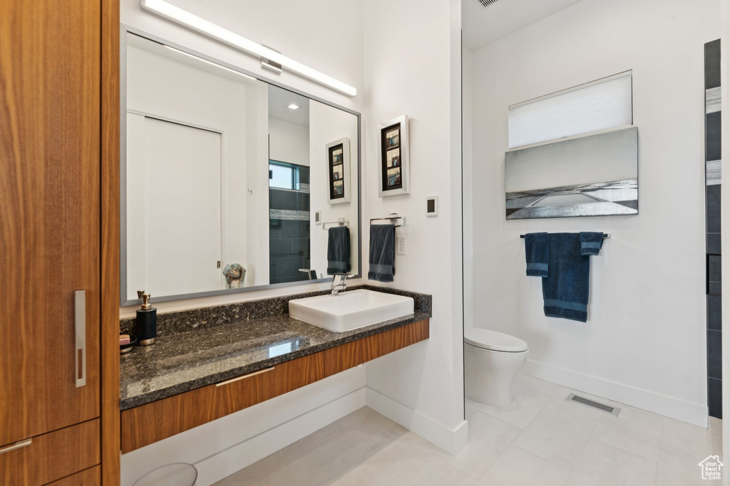 Bathroom featuring vanity and tile patterned flooring
