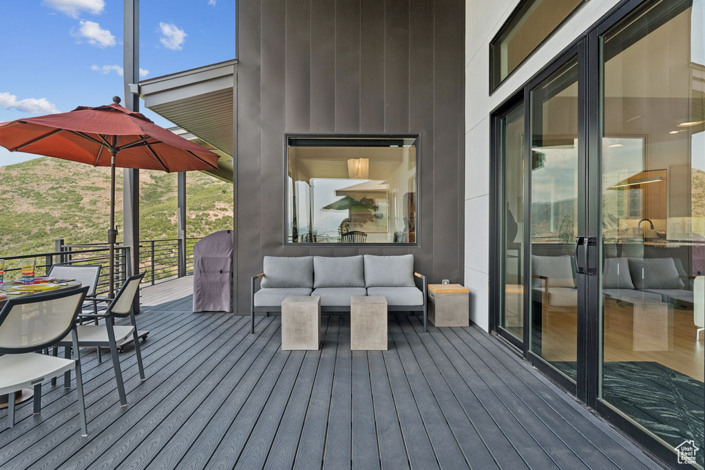 Wooden terrace with outdoor lounge area