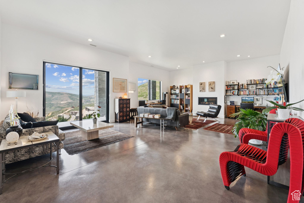 Living area with concrete floors and recessed lighting