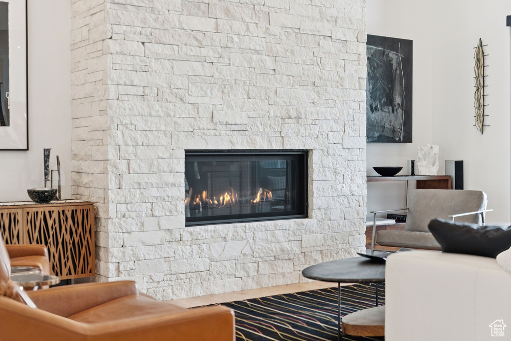 Living area with a fireplace and wood finished floors