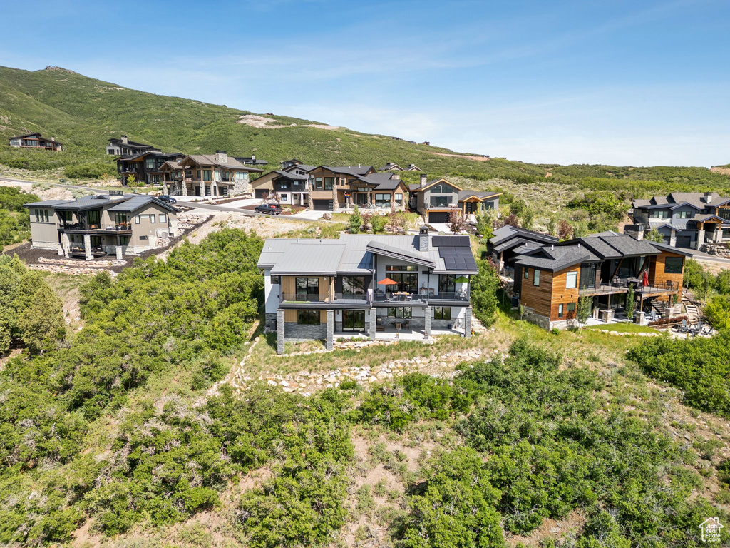 Aerial perspective of suburban area with a mountainous background