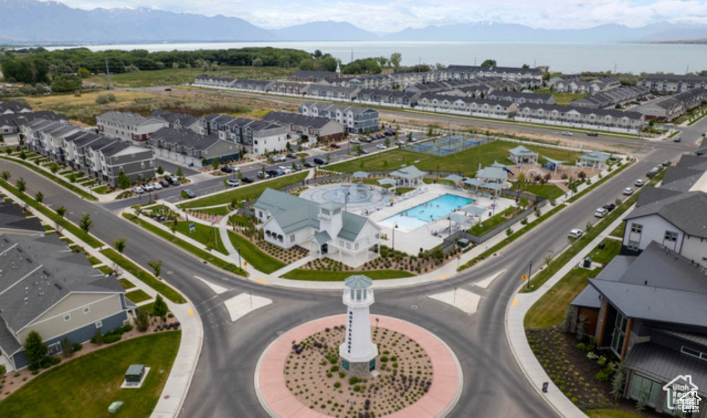 Aerial view of a pool and a mountainous background