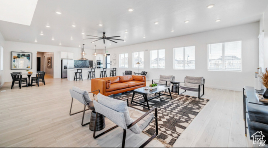 Living room with recessed lighting and light wood finished floors