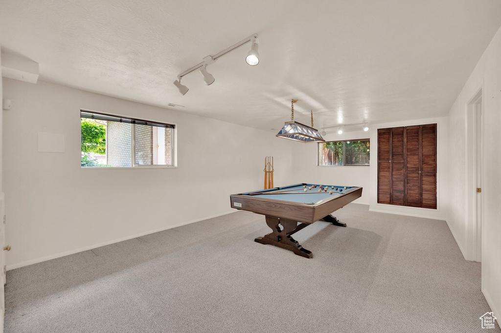 Recreation room with billiards table, carpet, and rail lighting