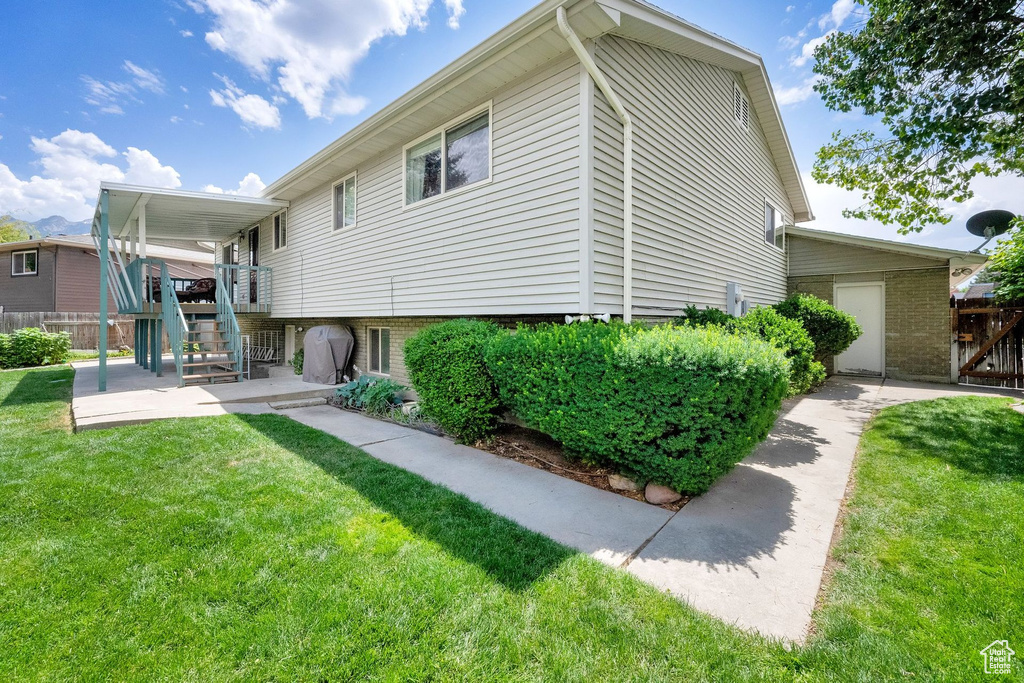 View of side of property with a patio