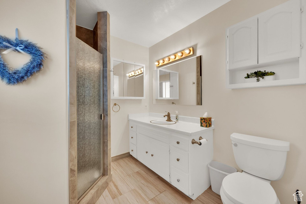 Bathroom with vanity and a stall shower