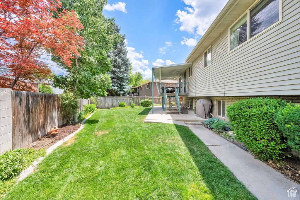Fenced backyard featuring a patio area