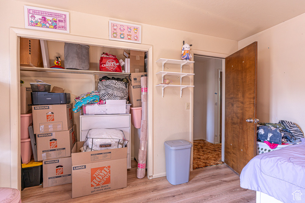 Bedroom with wood finished floors