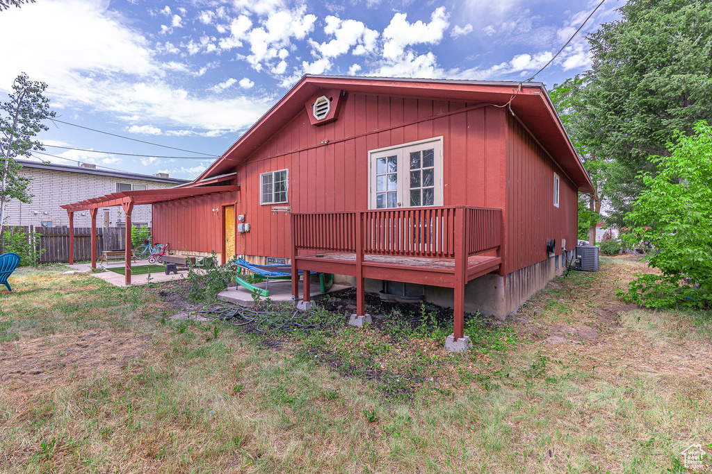 Rear view of property with a patio and a deck