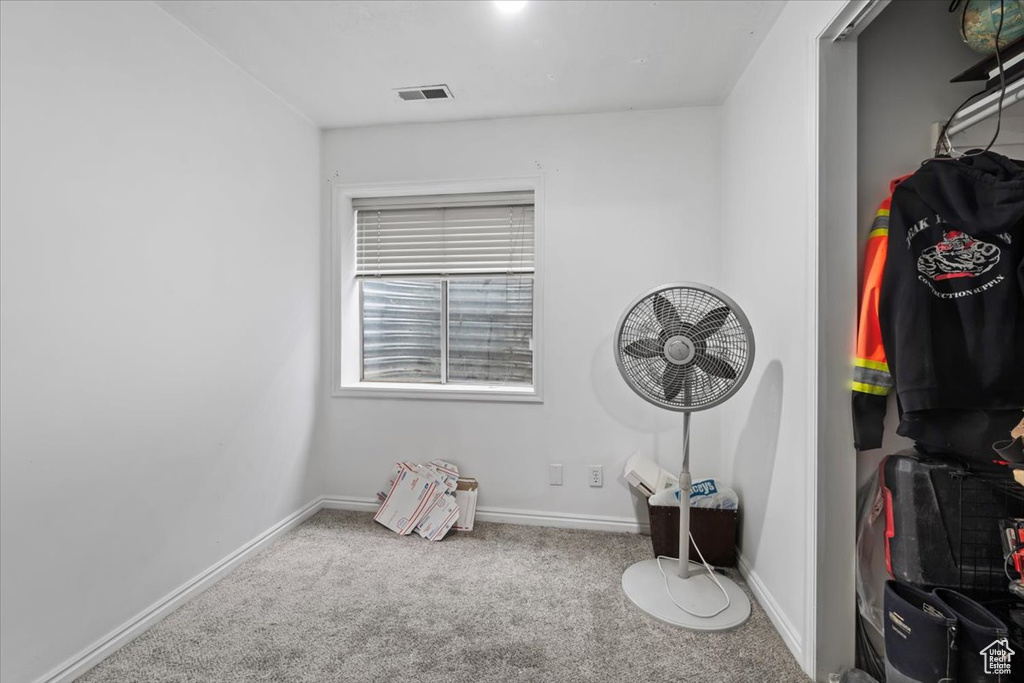 Carpeted bedroom featuring baseboards