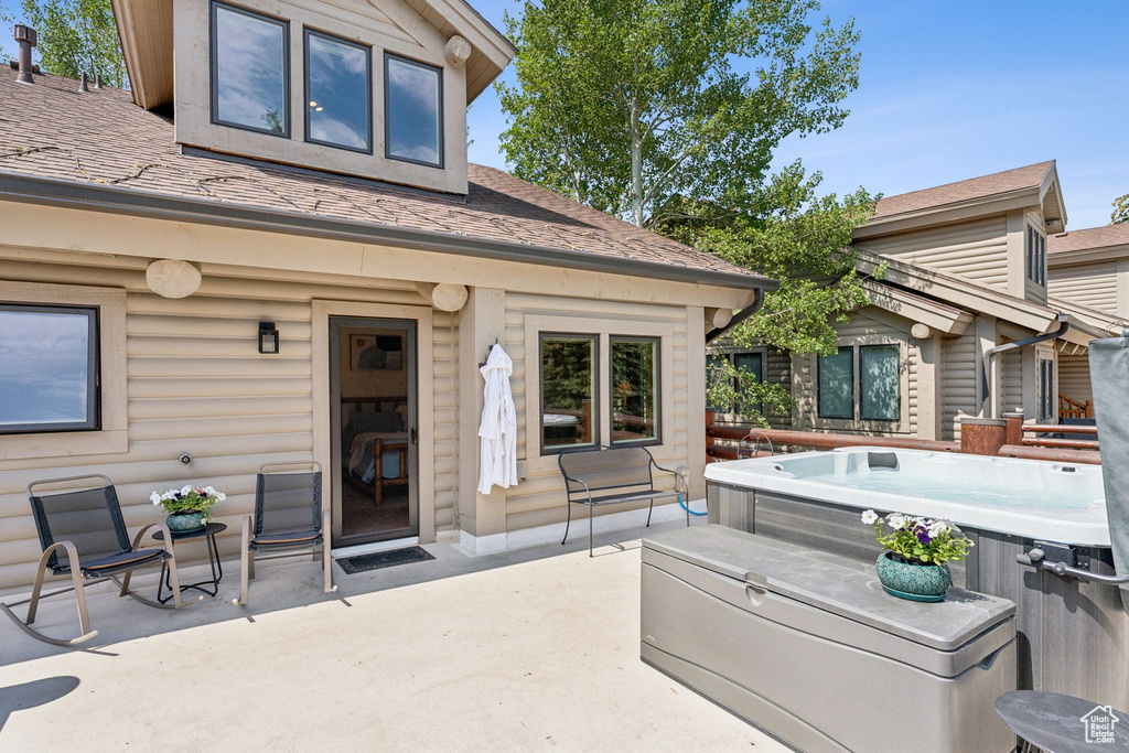 View of patio featuring a hot tub