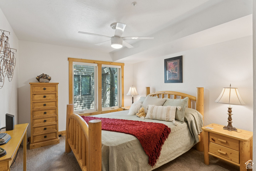 Bedroom featuring carpet and ceiling fan