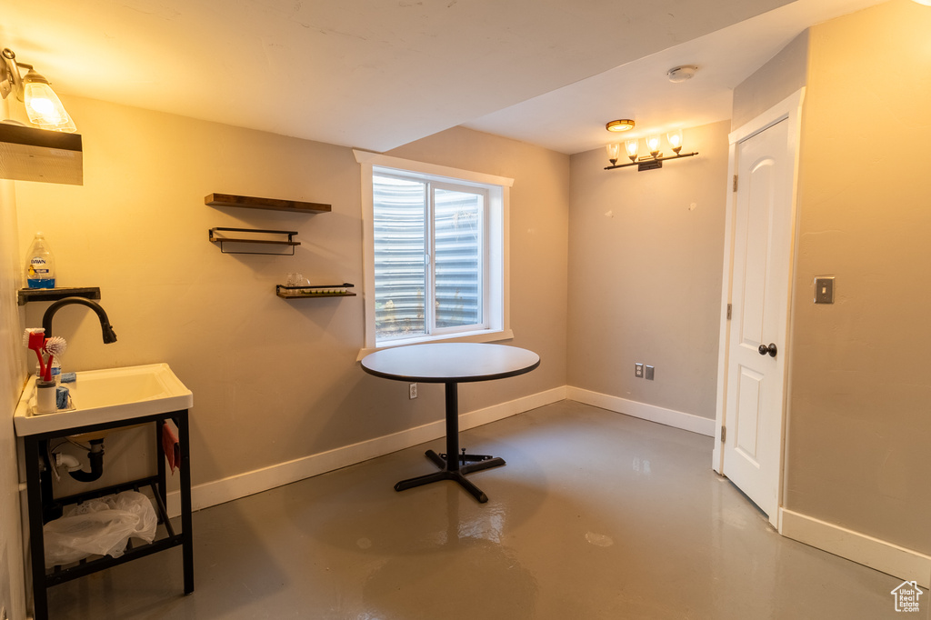 Bathroom with finished concrete floors and baseboards