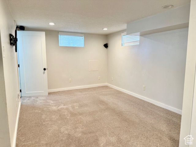 Basement with carpet and recessed lighting