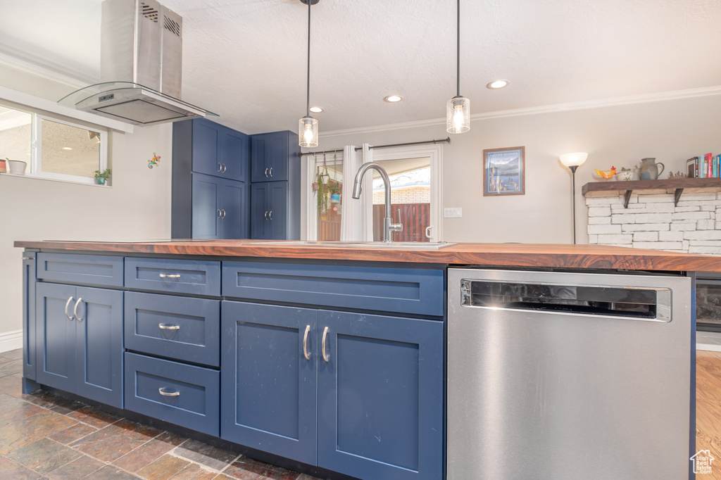 Kitchen with wooden counters, stainless steel dishwasher, blue cabinetry, island range hood, and ornamental molding