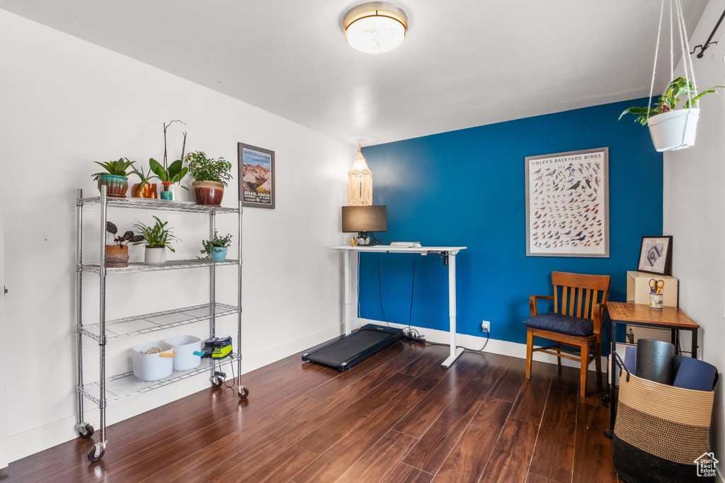 Living area featuring wood finished floors and baseboards