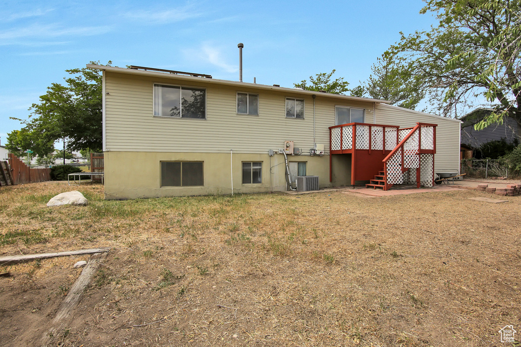 Back of property with a wooden deck