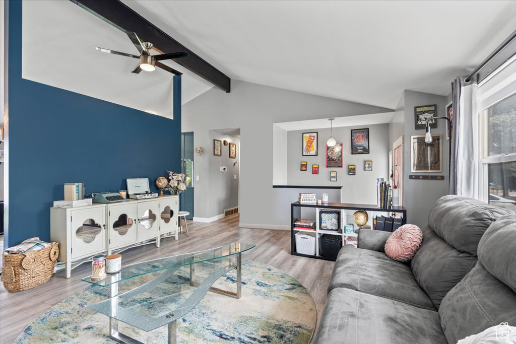 Living room with ceiling fan and wood finished floors