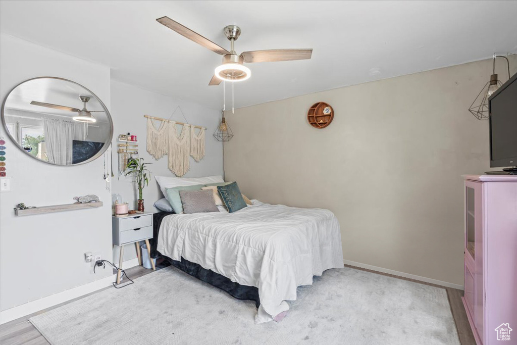 Bedroom with baseboards and ceiling fan