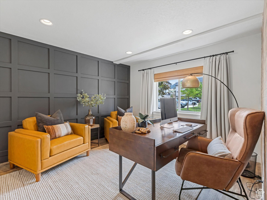 Office space with a decorative wall and recessed lighting