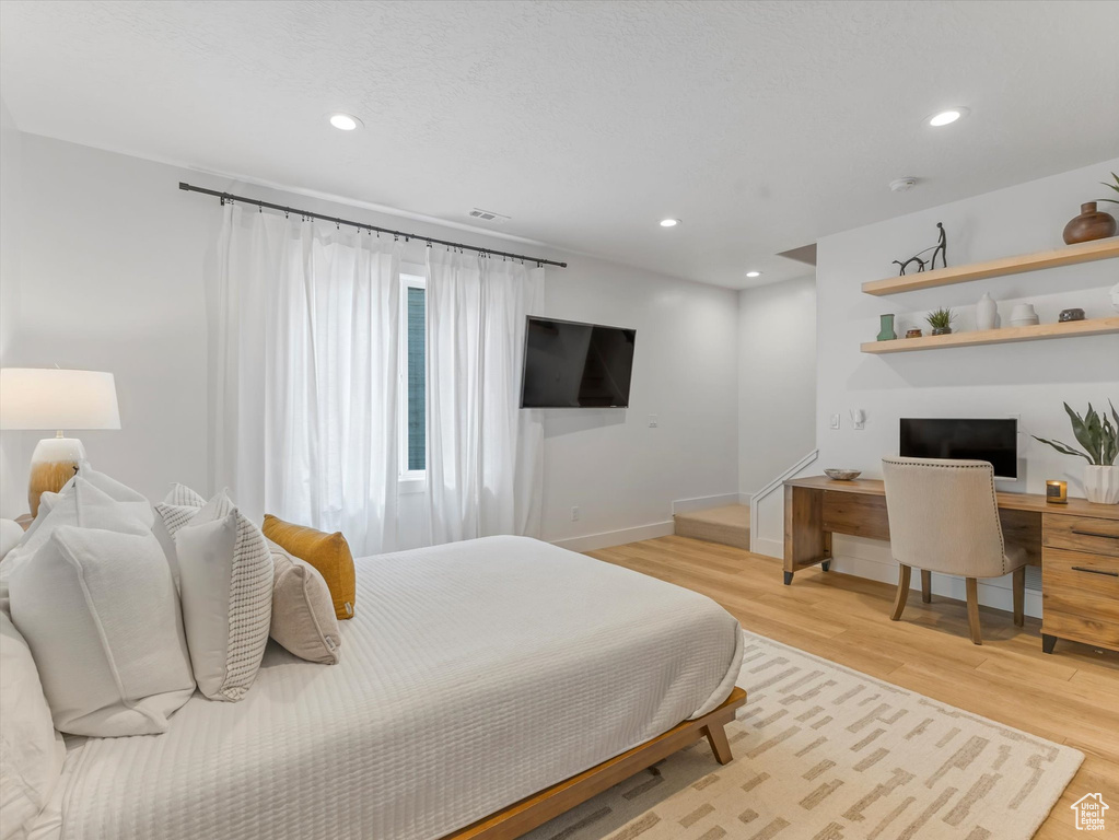 Bedroom featuring an office area, recessed lighting, and light wood-type flooring