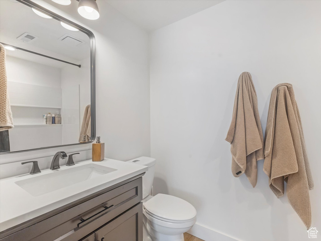 Bathroom with toilet and vanity