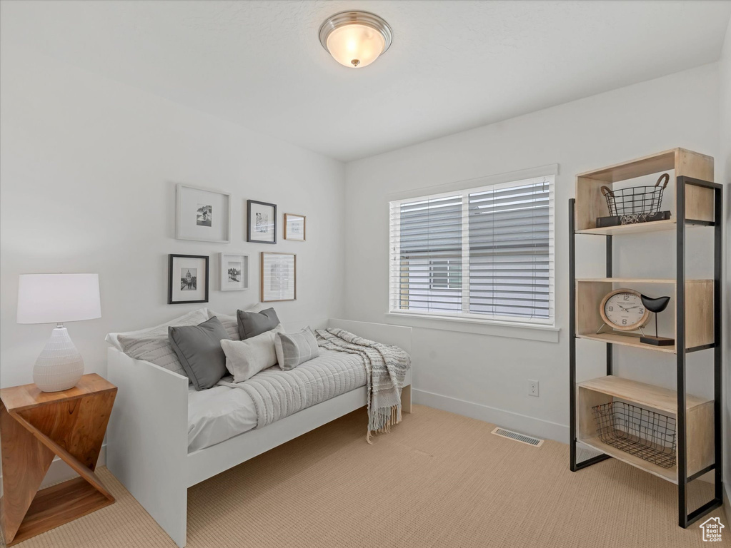 Carpeted bedroom with baseboards