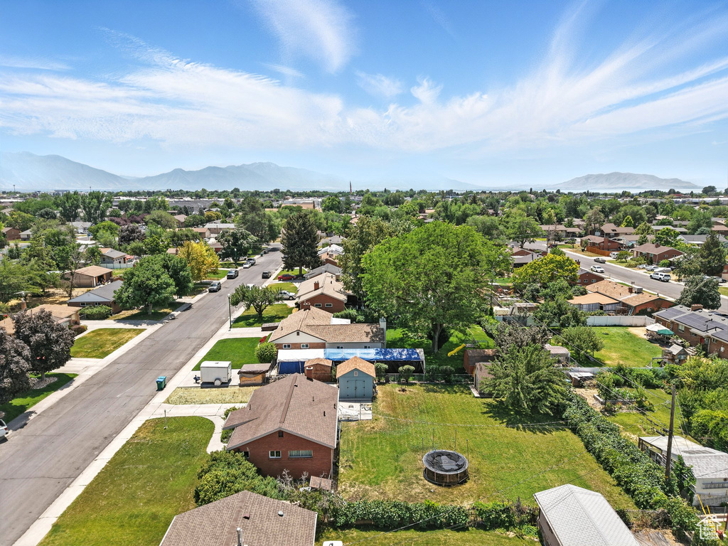 Aerial view of residential area featuring a mountain backdrop