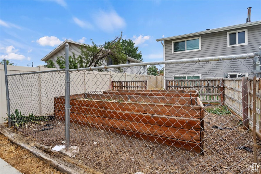 View of fenced backyard