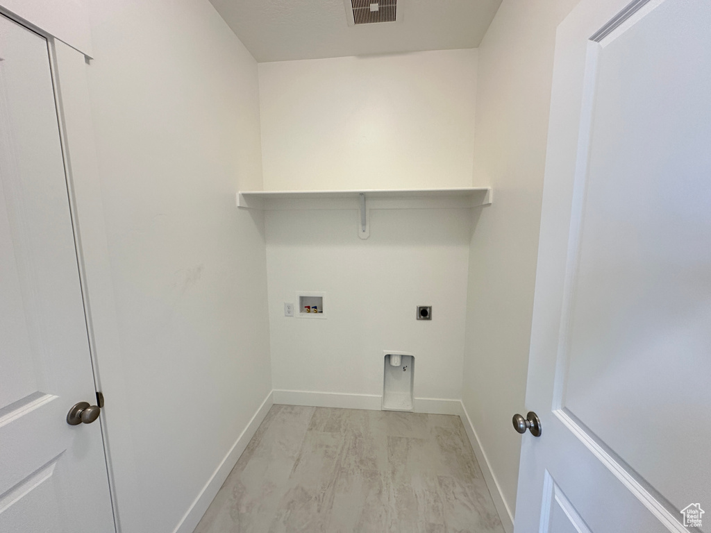 Laundry area featuring electric dryer hookup and hookup for a washing machine