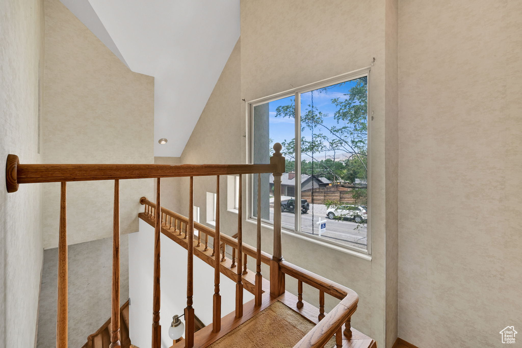 Stairway with high vaulted ceiling