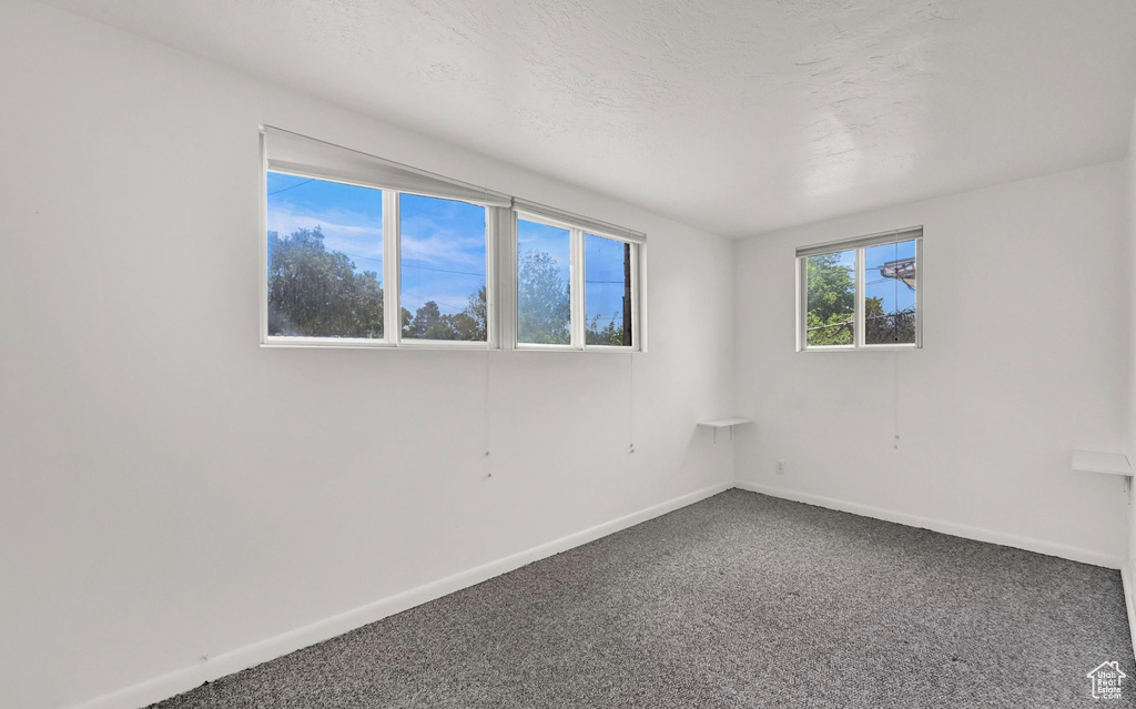 Spare room with carpet flooring and baseboards