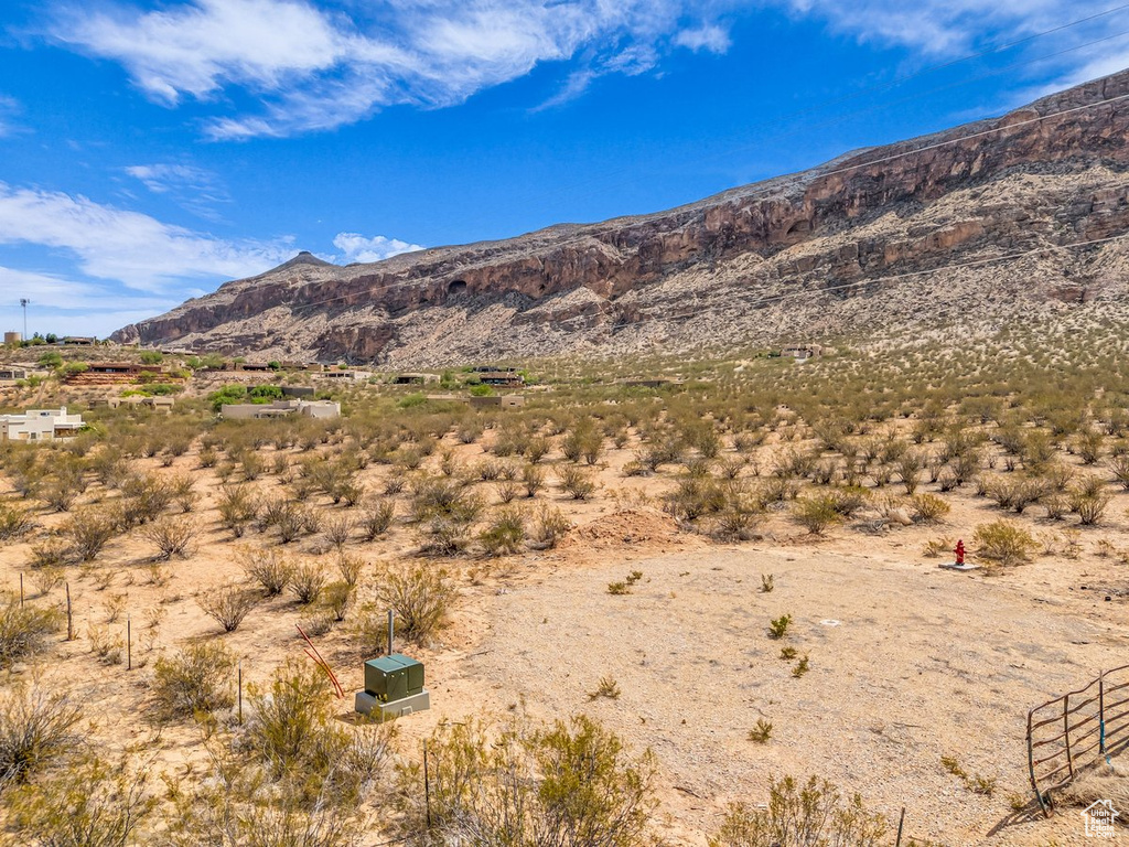 View of mountain backdrop featuring a desert landscape