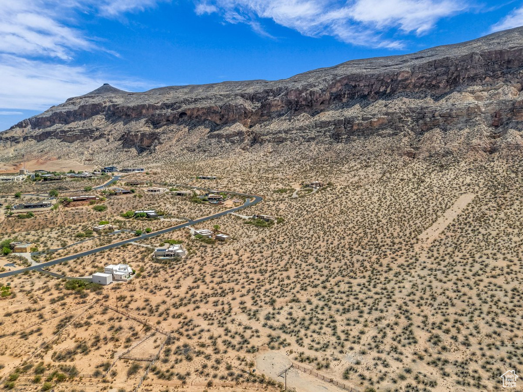 View of mountain backdrop featuring a desert landscape