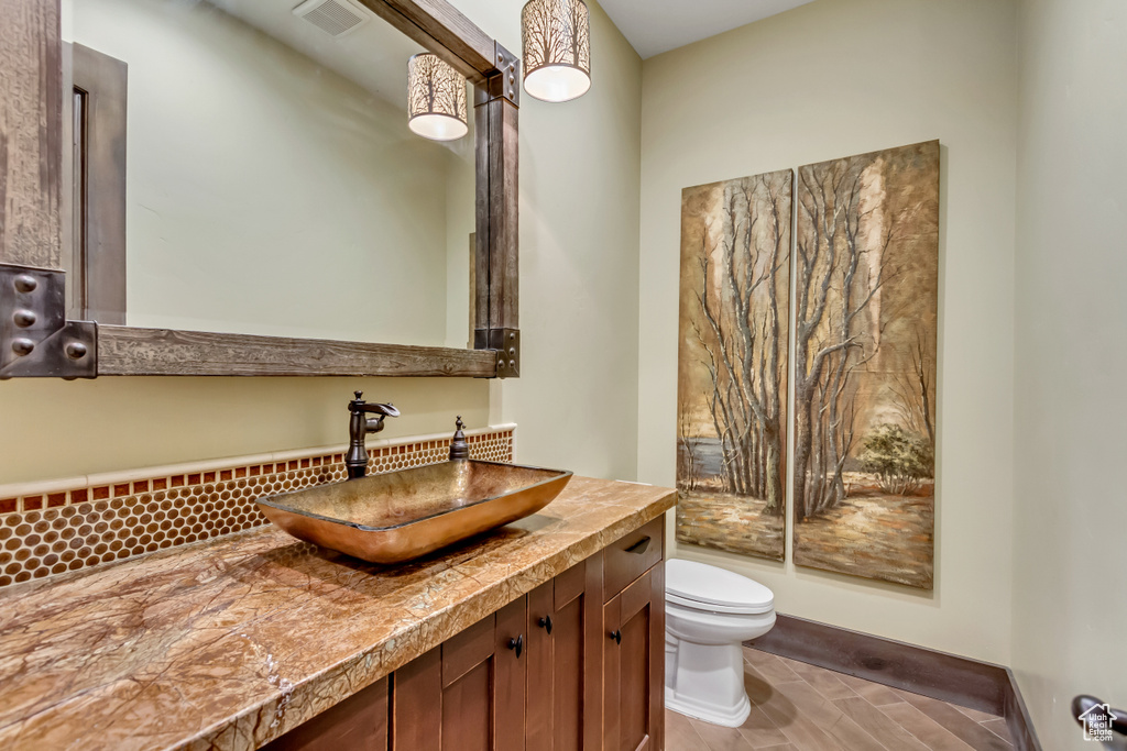 Bathroom featuring toilet and vanity