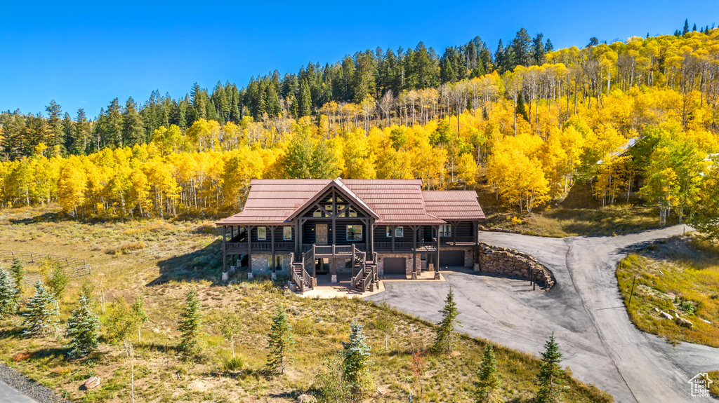 View from above of property with a heavily wooded area