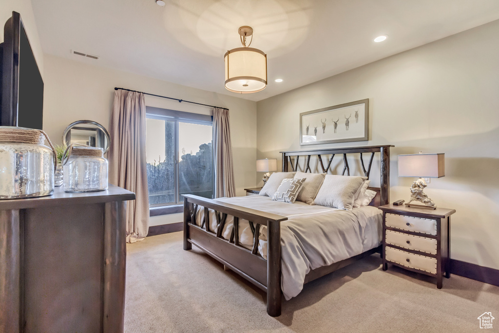 Bedroom featuring light carpet and recessed lighting