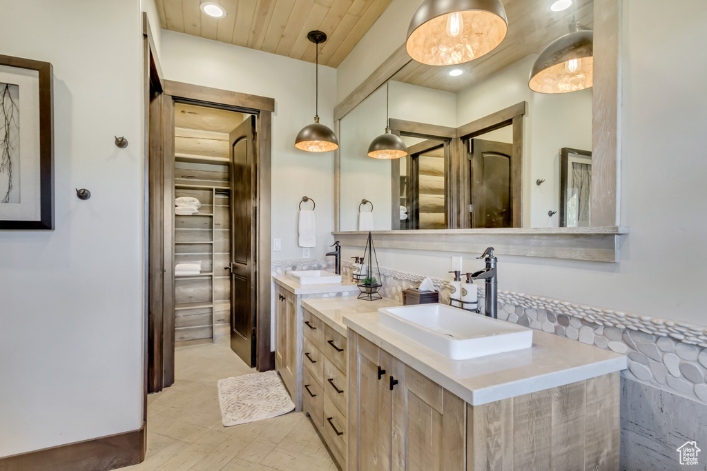 Bathroom featuring double vanity and recessed lighting