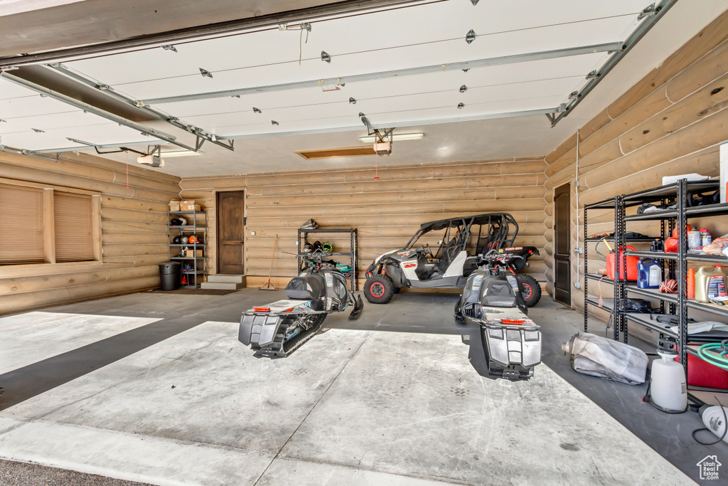 Garage featuring a garage door opener