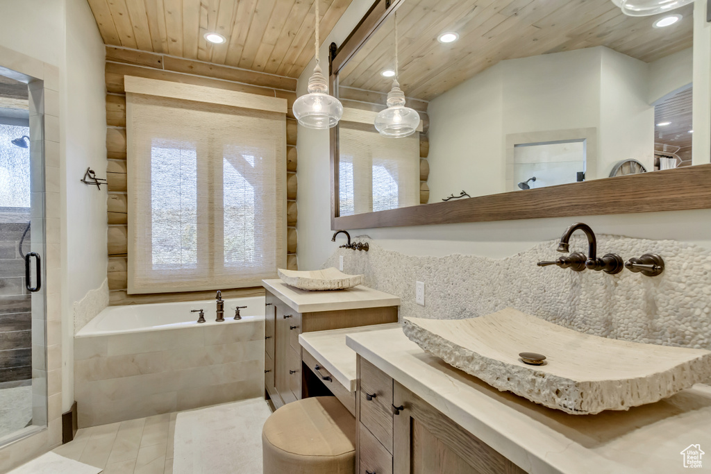 Full bath featuring wood ceiling, a garden tub, a stall shower, recessed lighting, and vanity
