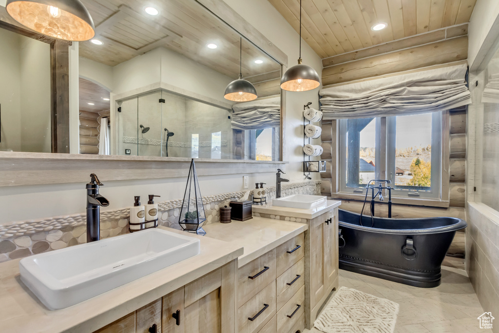 Bathroom with recessed lighting, double vanity, wood ceiling, a soaking tub, and a stall shower