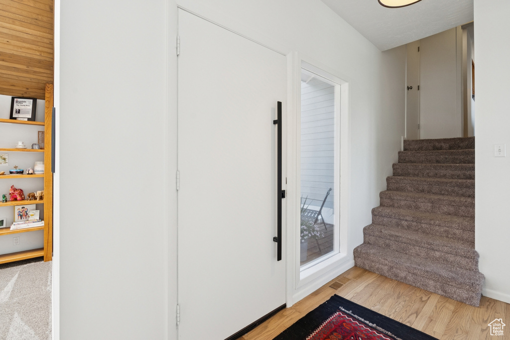 Stairway with wood finished floors