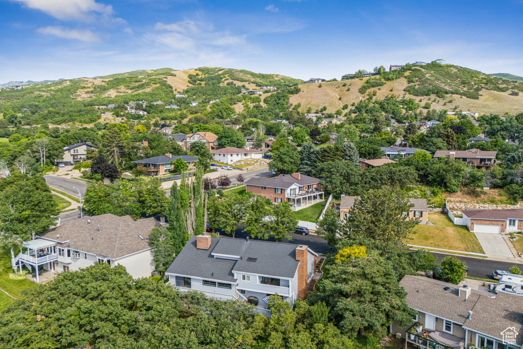 Aerial view of residential area featuring mountains