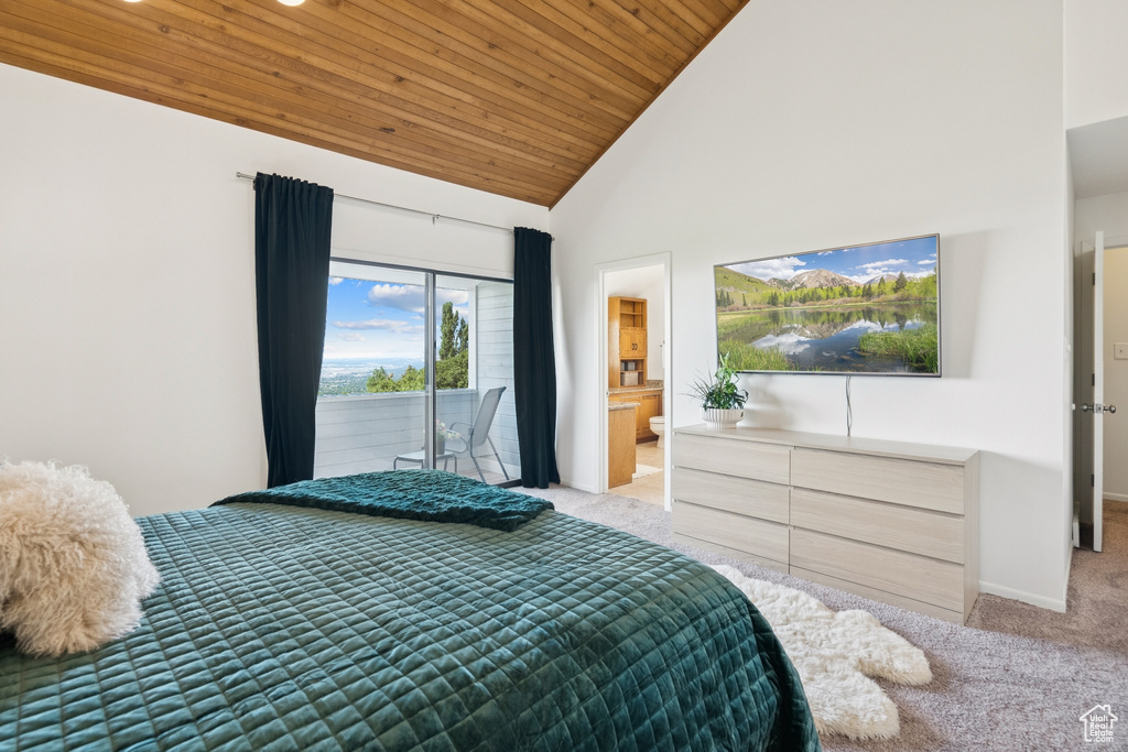 Bedroom with light colored carpet, wood ceiling, access to exterior, high vaulted ceiling, and connected bathroom