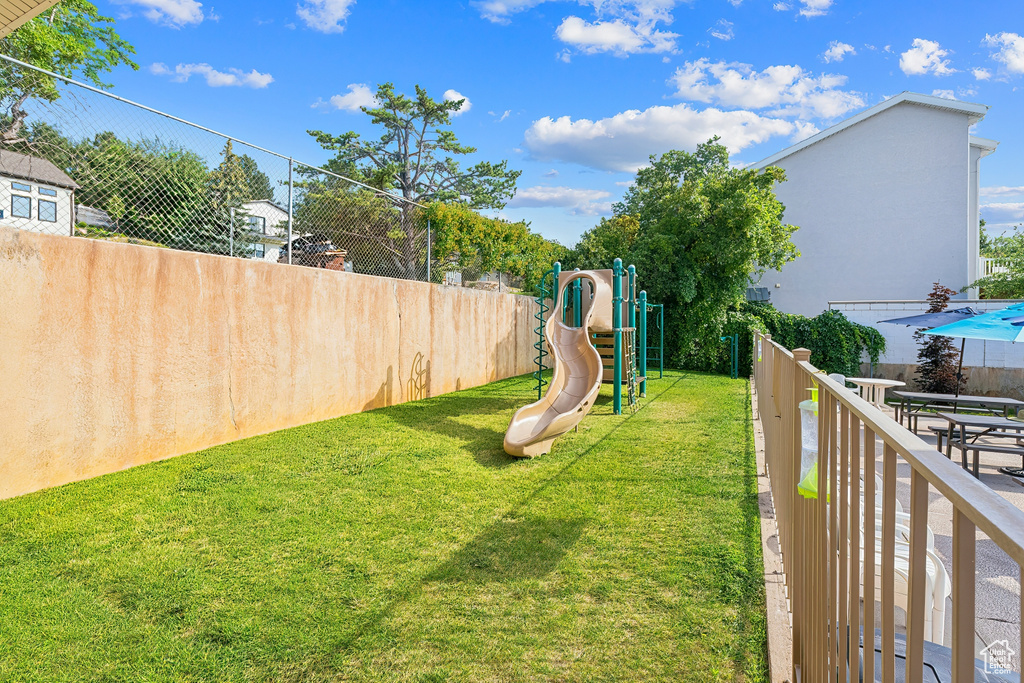 View of yard featuring a playground