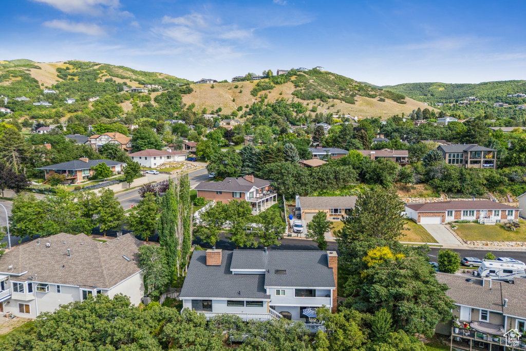 Aerial view of residential area with a mountainous background