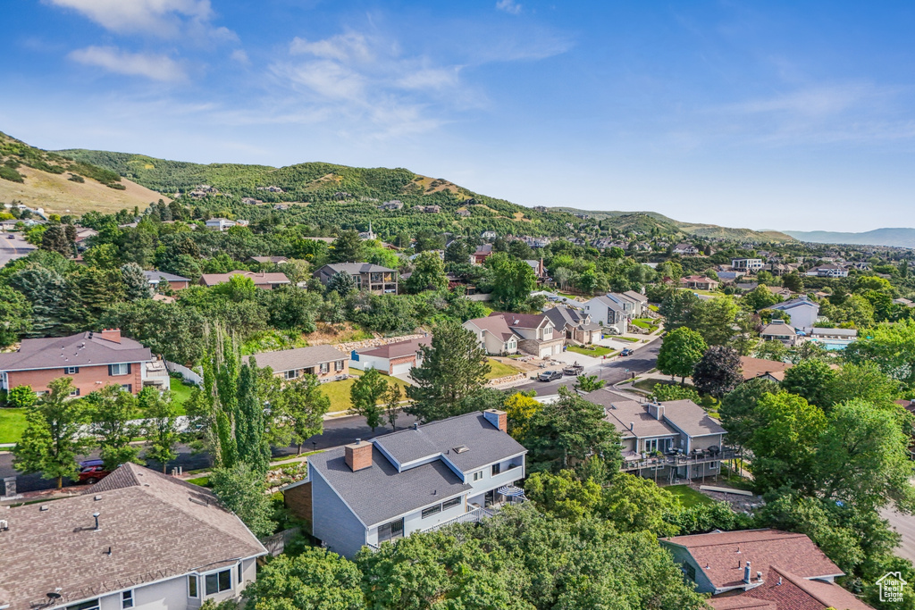 Aerial view of residential area featuring mountains